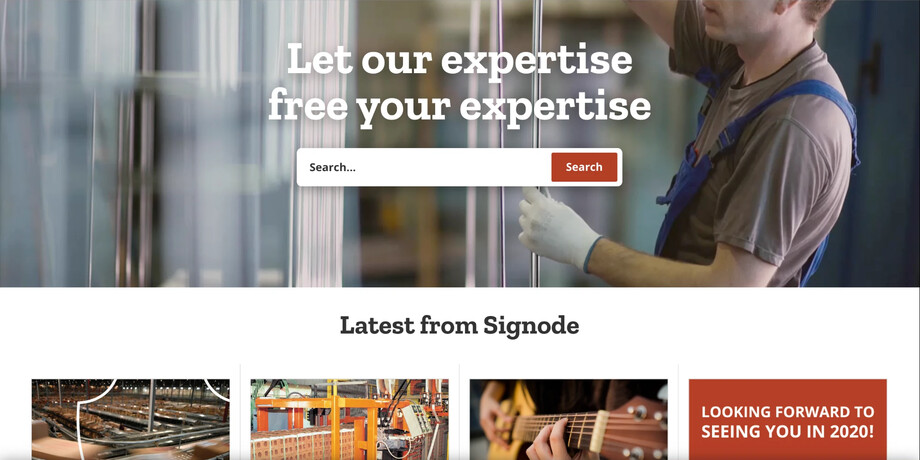 Signode homepage, as archived by the Wayback Machine in December 2019: a warehouse worker behind the headline “Let our expertise free your expertise” and a search bar, with a row of “Latest from Signode” news cards below.